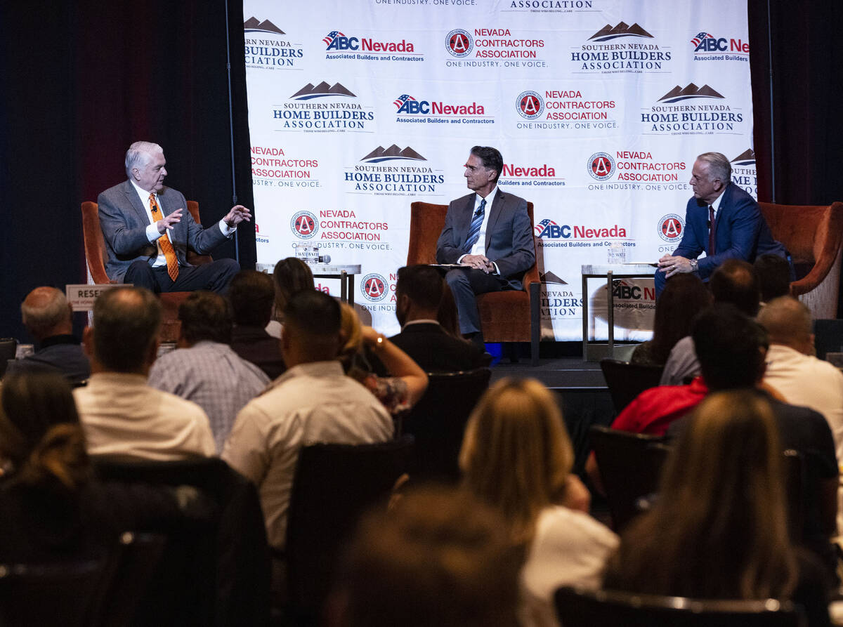Gov. Steve Sisolak, left, speaks as moderator Mitch Fox, president and CEO of the Nevada Broadc ...