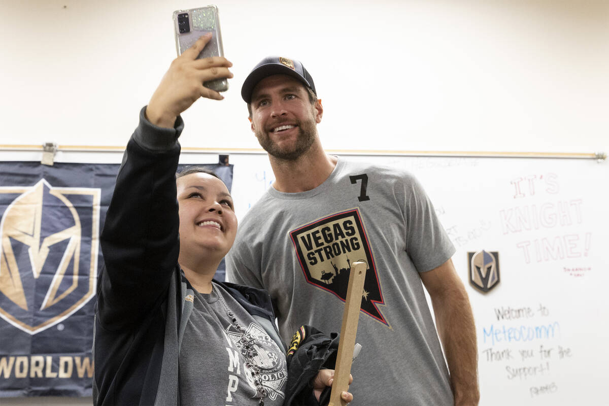 Jesse Minogue, a 911 call taker, takes a selfie with Golden Knights defenseman Alex Pietrangelo ...