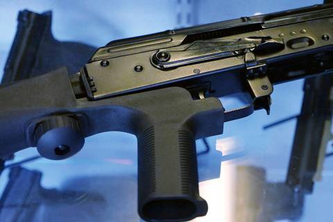 In this Oct. 4, 2017 file photo, a device called a "bump stock" is attached to a semi-automatic ...