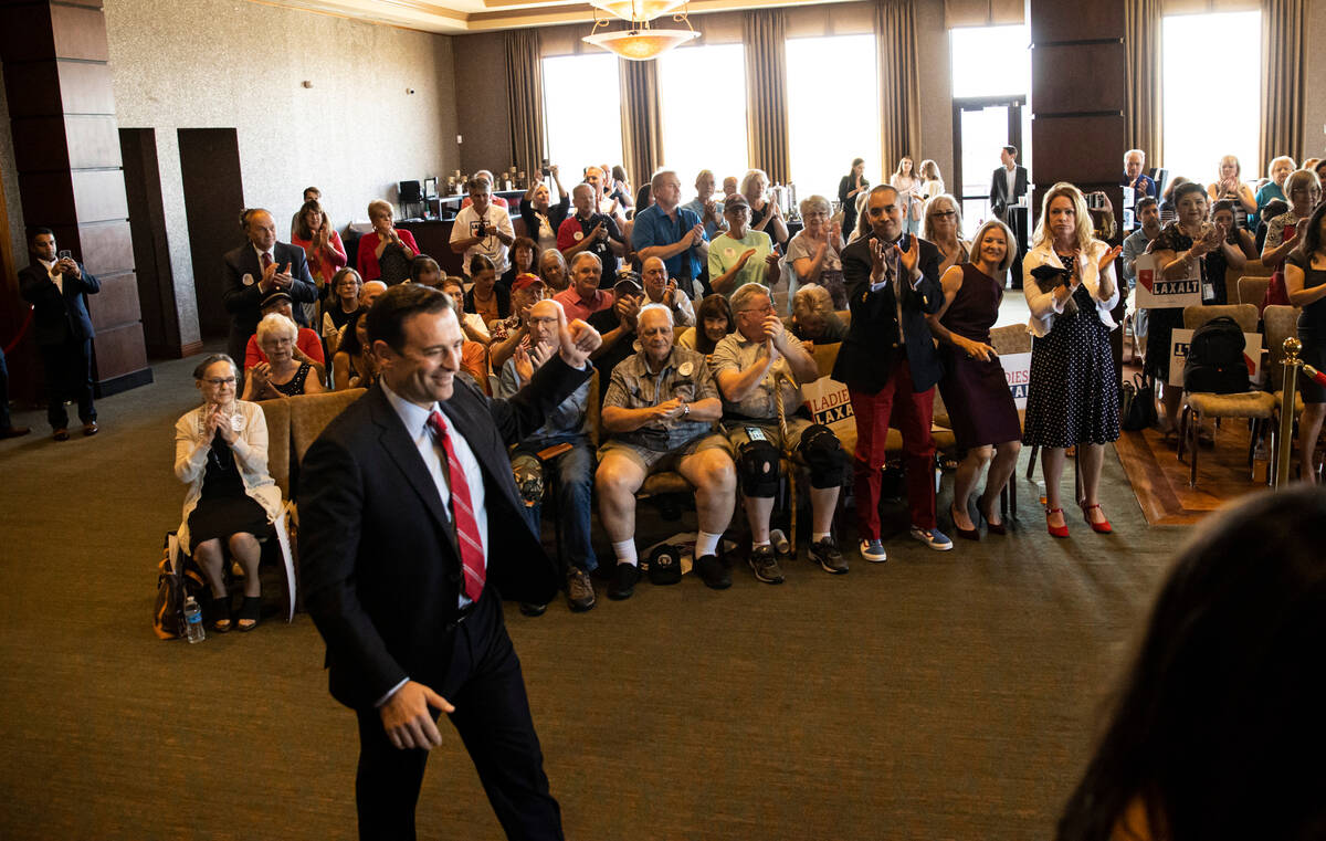 Nevada Republican U.S. Senate candidate Adam Laxalt, center right, is introduced at a campaign ...