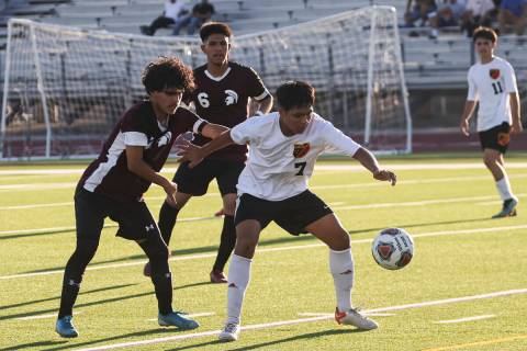 Las Vegas' Daryan Coronel (7) moves the ball under pressure from Cimarron-Memorial during a soc ...