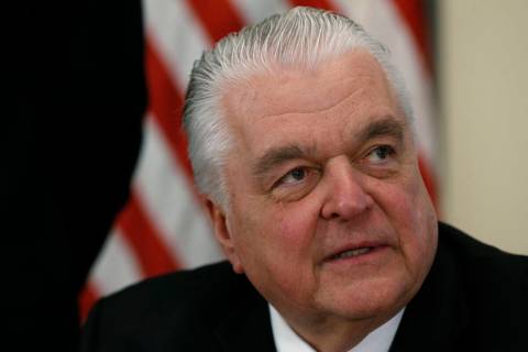FILE - Nevada Gov. Steve Sisolak signs his first executive order calling for a task force to ad ...