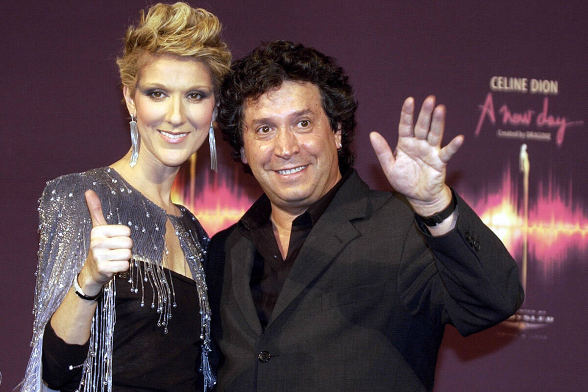 Celine Dion poses with artistic director Franco Dragone at a news conference after the opening ...
