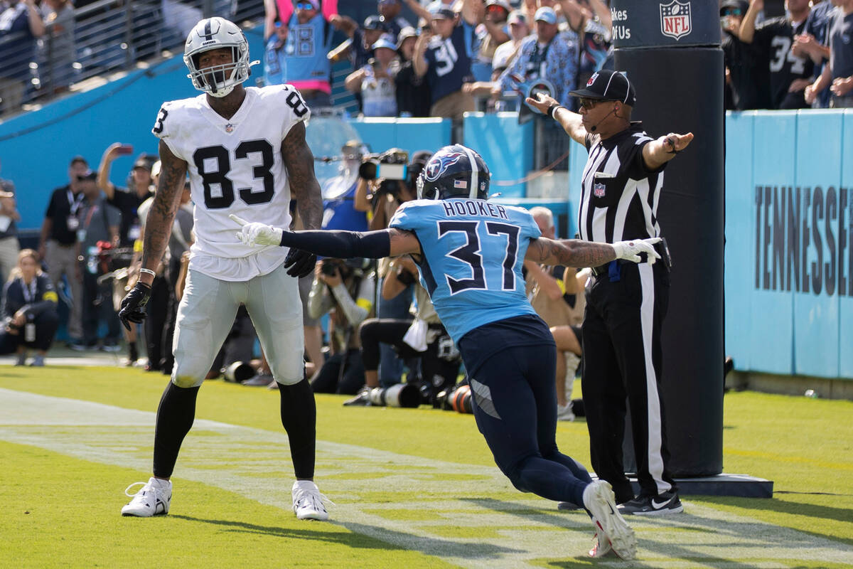 Tennessee Titans safety Amani Hooker (37) celebrates in front of Raiders tight end Darren Walle ...