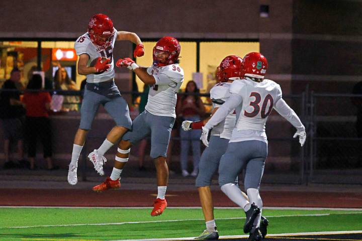 Arbor View’s Tanner Aitken (15), left, celebrates with his teammate after he scored a to ...
