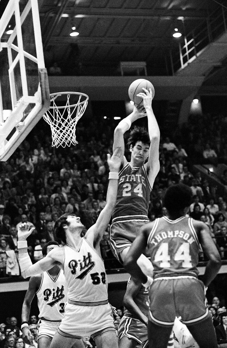 Tom Burleson (24), of North Carolina State, takes command of a rebound over Pittsburgh's Jim Bo ...