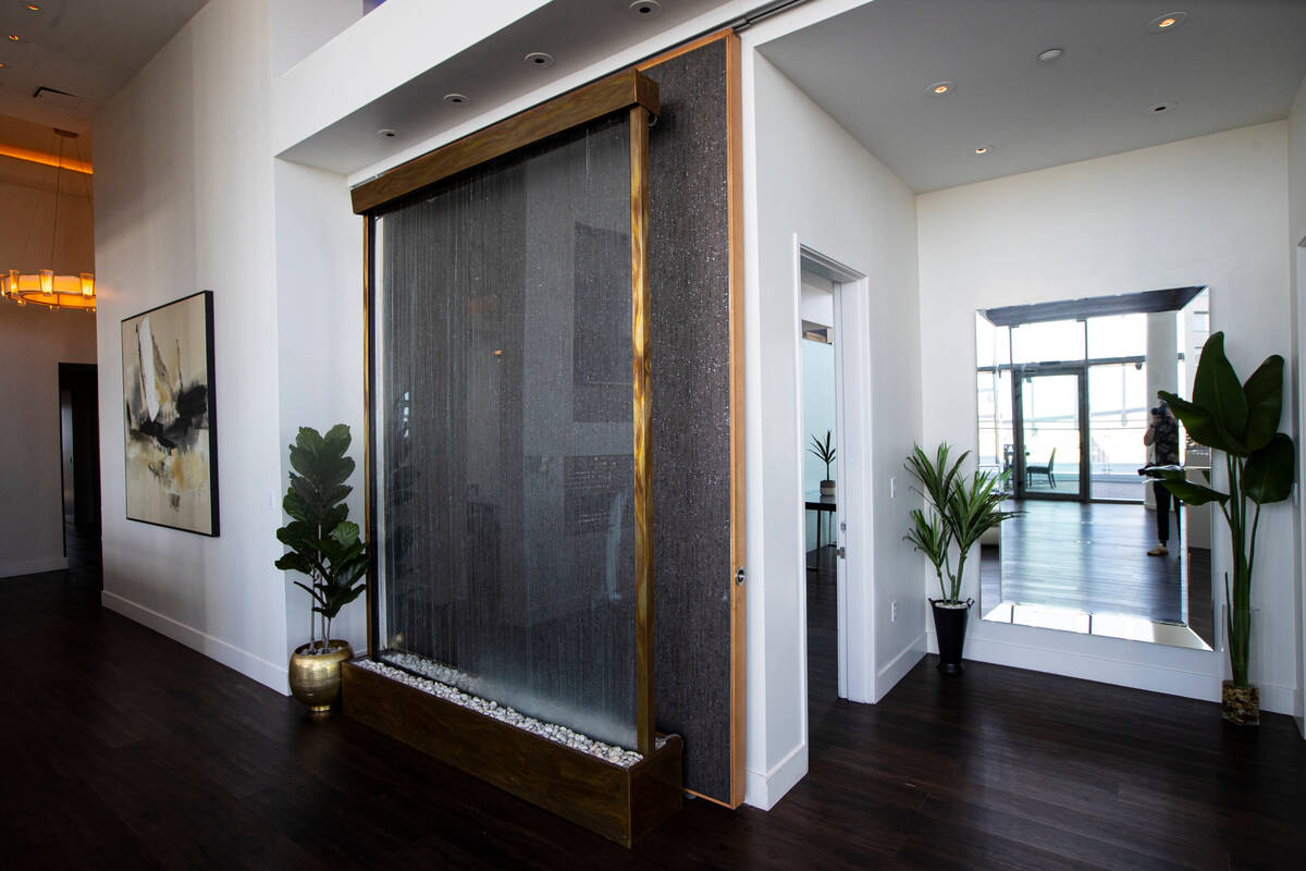 A hallway, right, leads to two guest suites at the Palms Place penthouse locator on the entire ...