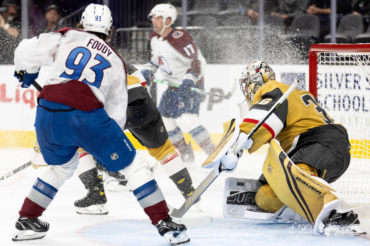 Golden Knights goaltender Logan Thompson (36) defends the net against Avalanche forward Jean-Lu ...