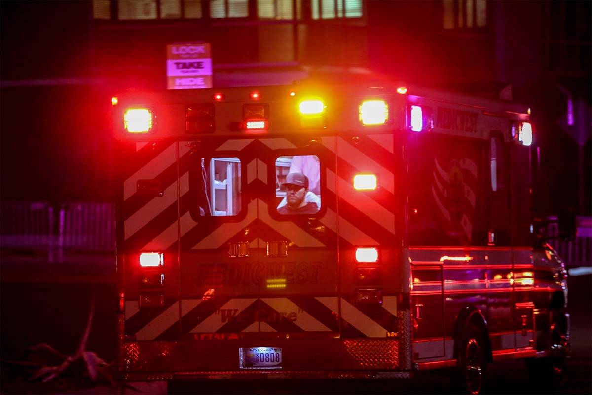 An ambulance with a patient inside rushes to the trauma emergency room at the Sunrise Hospital ...