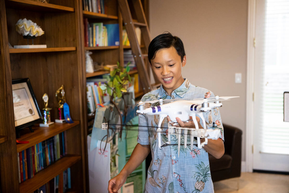 Luka Nguyen, 13, talks about his mangrove tree carbon sequestration project as seen at his home ...