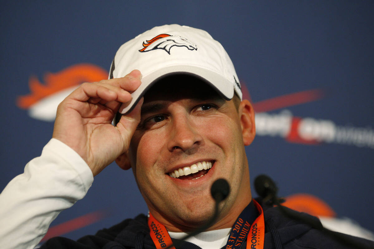 Denver Broncos head coach Josh McDaniels speaks to the media before the start of a football tra ...