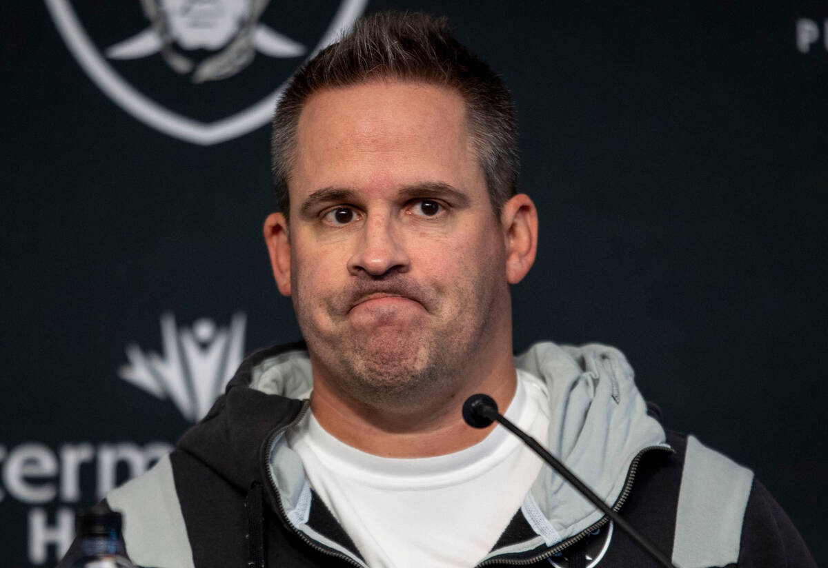 Raiders head coach Josh McDaniels reacts to a question asked during a news conference at the In ...