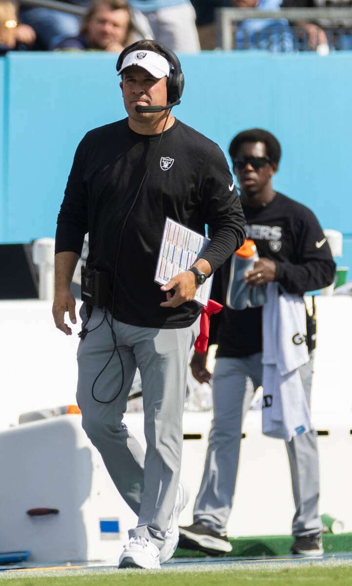 Raiders head coach Josh McDaniels walks the sidelines in the second half during an NFL football ...