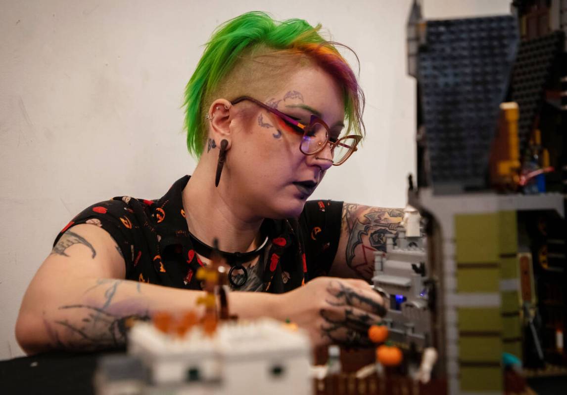 Stephanie Comito-Stephens works on a lego build at the Millenium Fandom Bar “Bricks n&#x ...