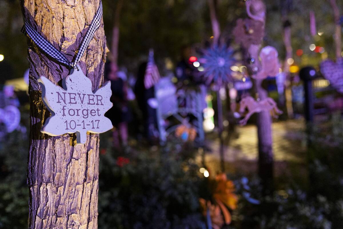 A decoration hangs from a tree at the Las Vegas Community Healing Garden in Las Vegas, Saturday ...