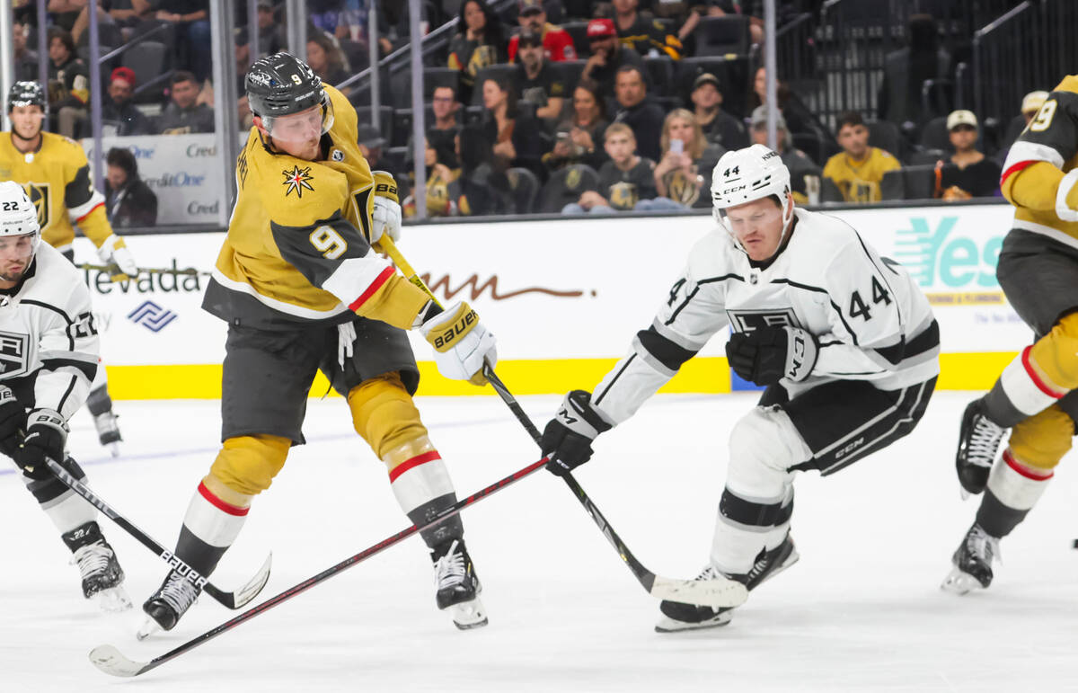 Golden Knights center Jack Eichel (9) shoots under pressure from Los Angeles Kings defenseman M ...