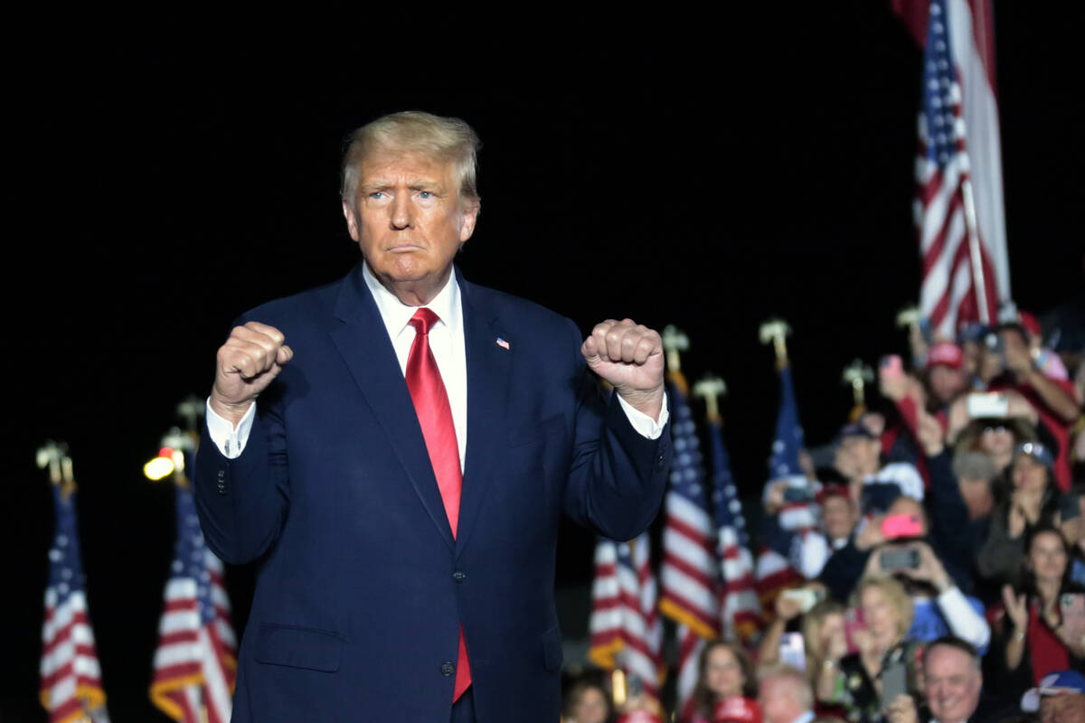 Former President Donald Trump gestures as he holds a rally Friday, Sept. 23, 2022, in Wilmingto ...