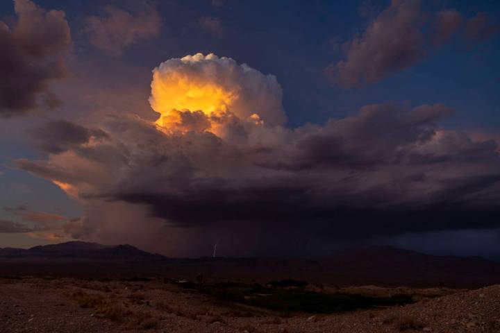 Lightning erupts as a monsoon storm moves across the valley on Thursday, Aug. 11, 2022, in Las ...