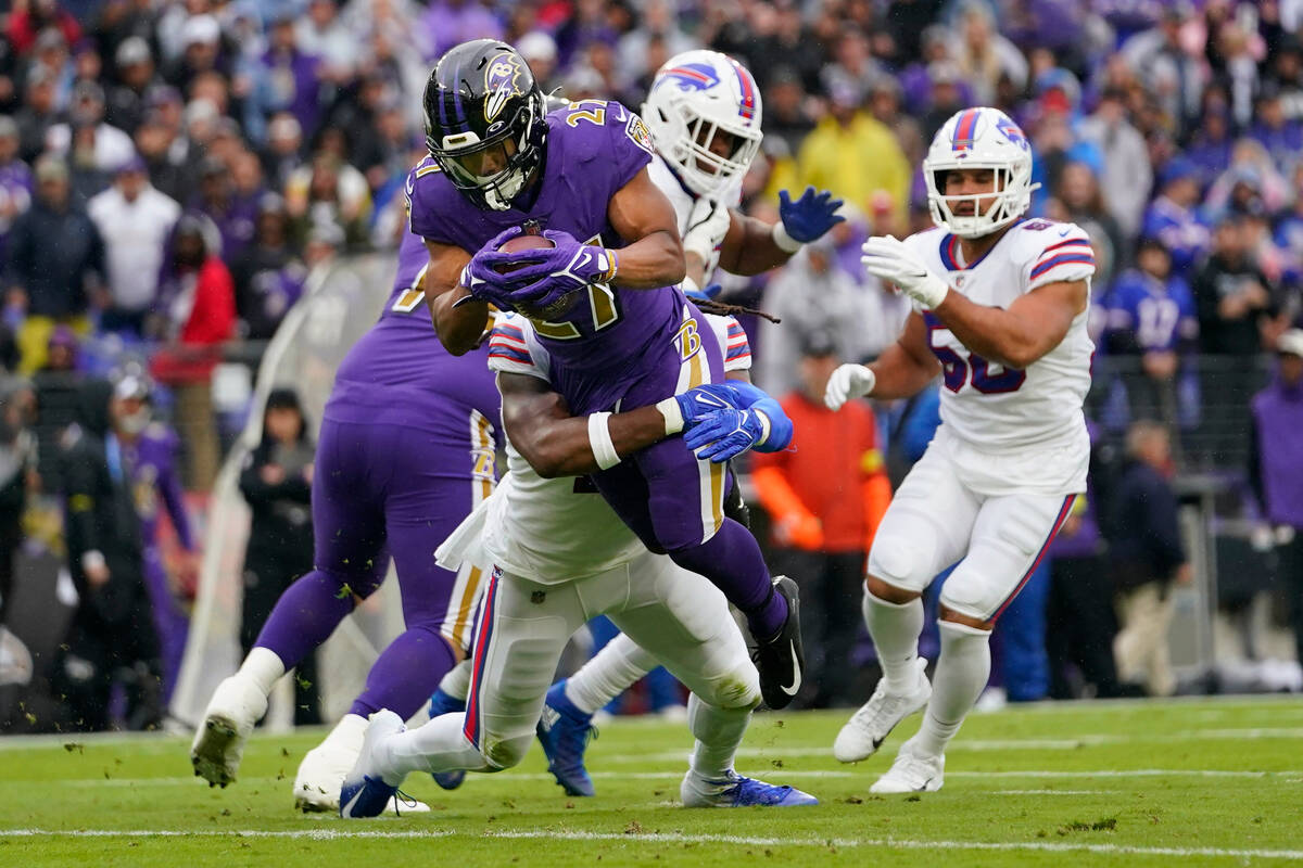 Baltimore Ravens running back J.K. Dobbins (27) scores a touchdown against the Buffalo Bills in ...