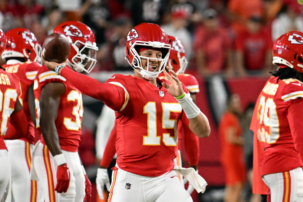 Kansas City Chiefs quarterback Patrick Mahomes warms up before an NFL football game against the ...