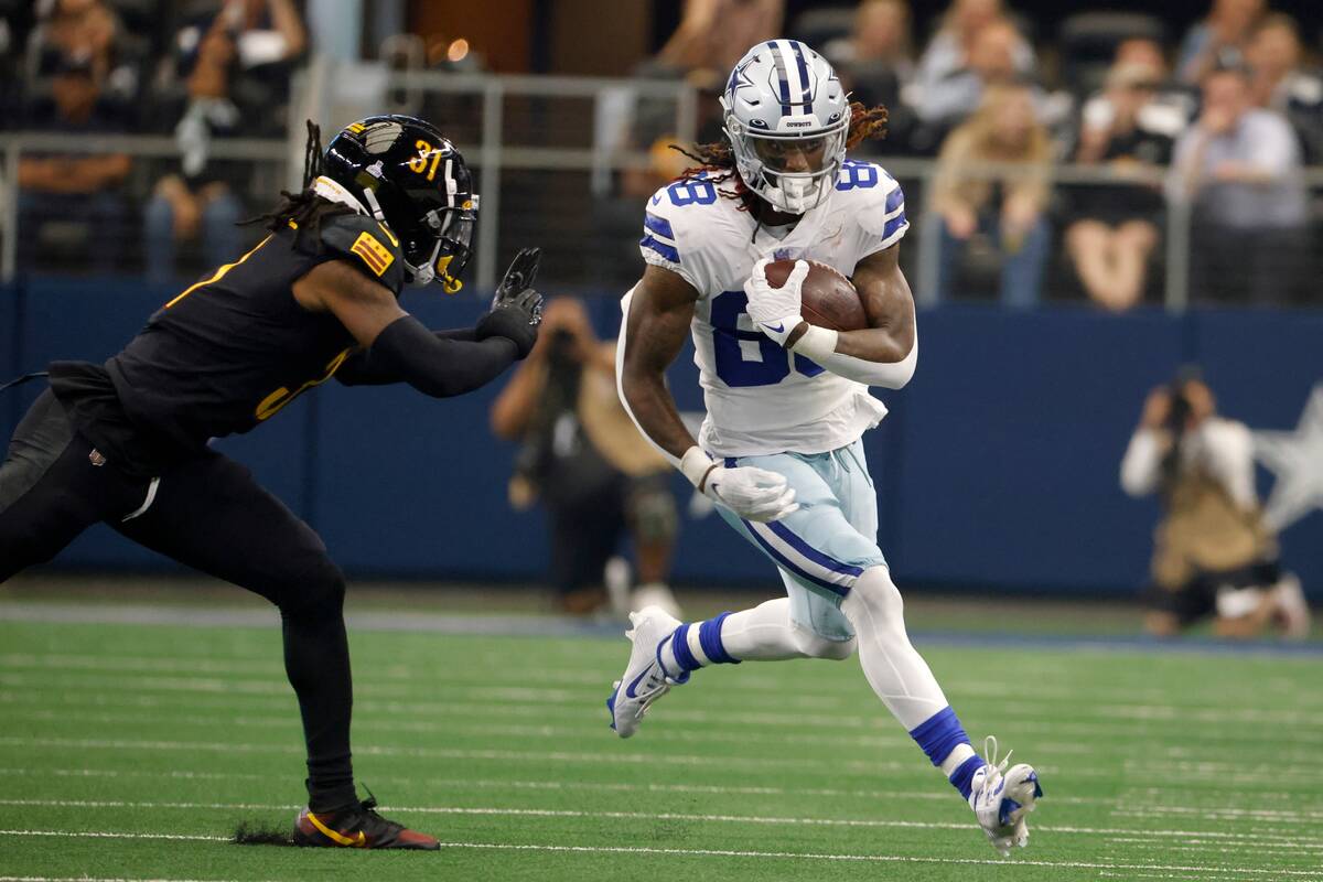 Dallas Cowboys wide receiver CeeDee Lamb (88) finds running room after catching a pass as Washi ...