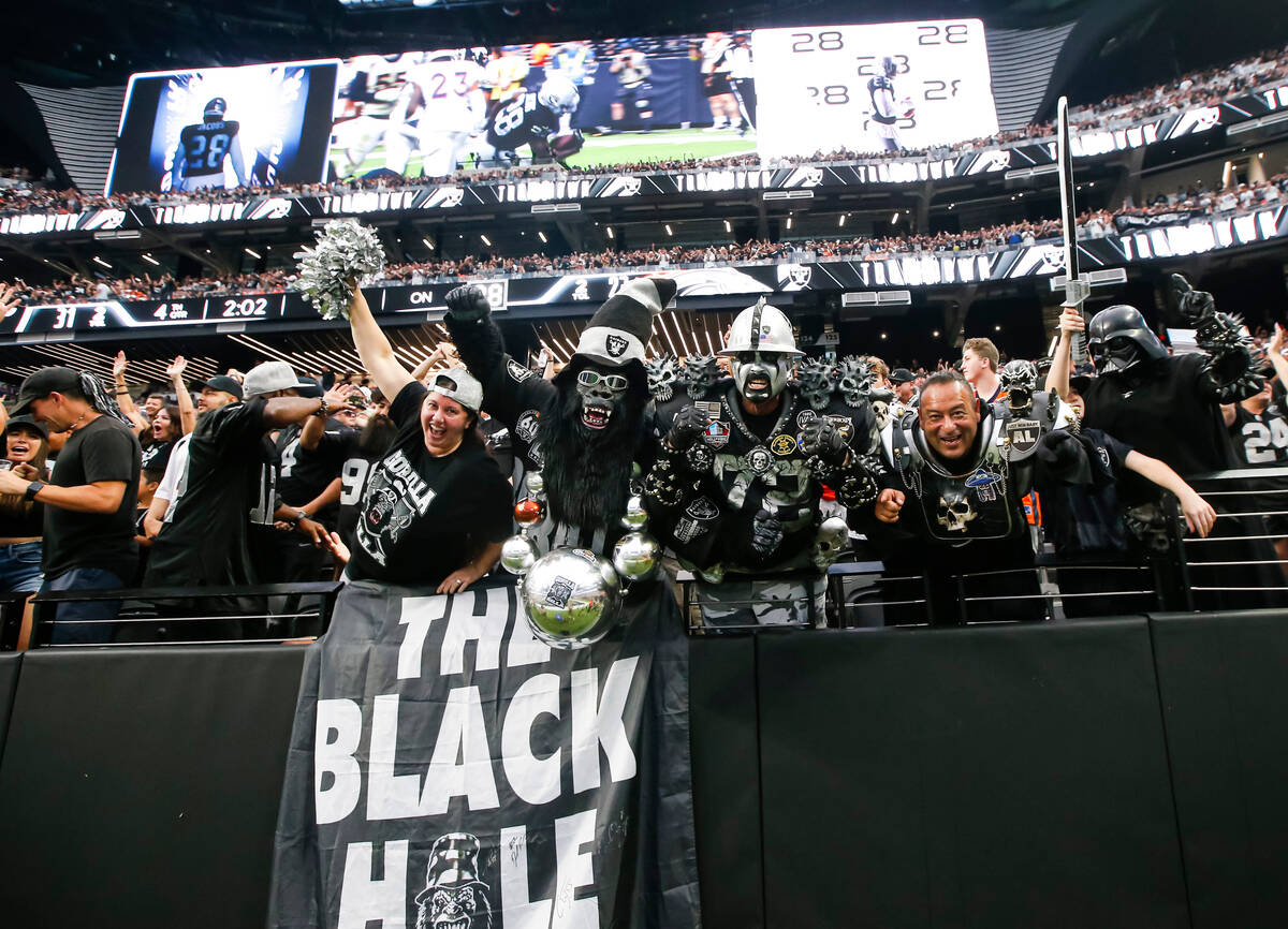 Raiders fans celebrate a touchdown by Raiders running back Josh Jacobs, not pictured, during th ...