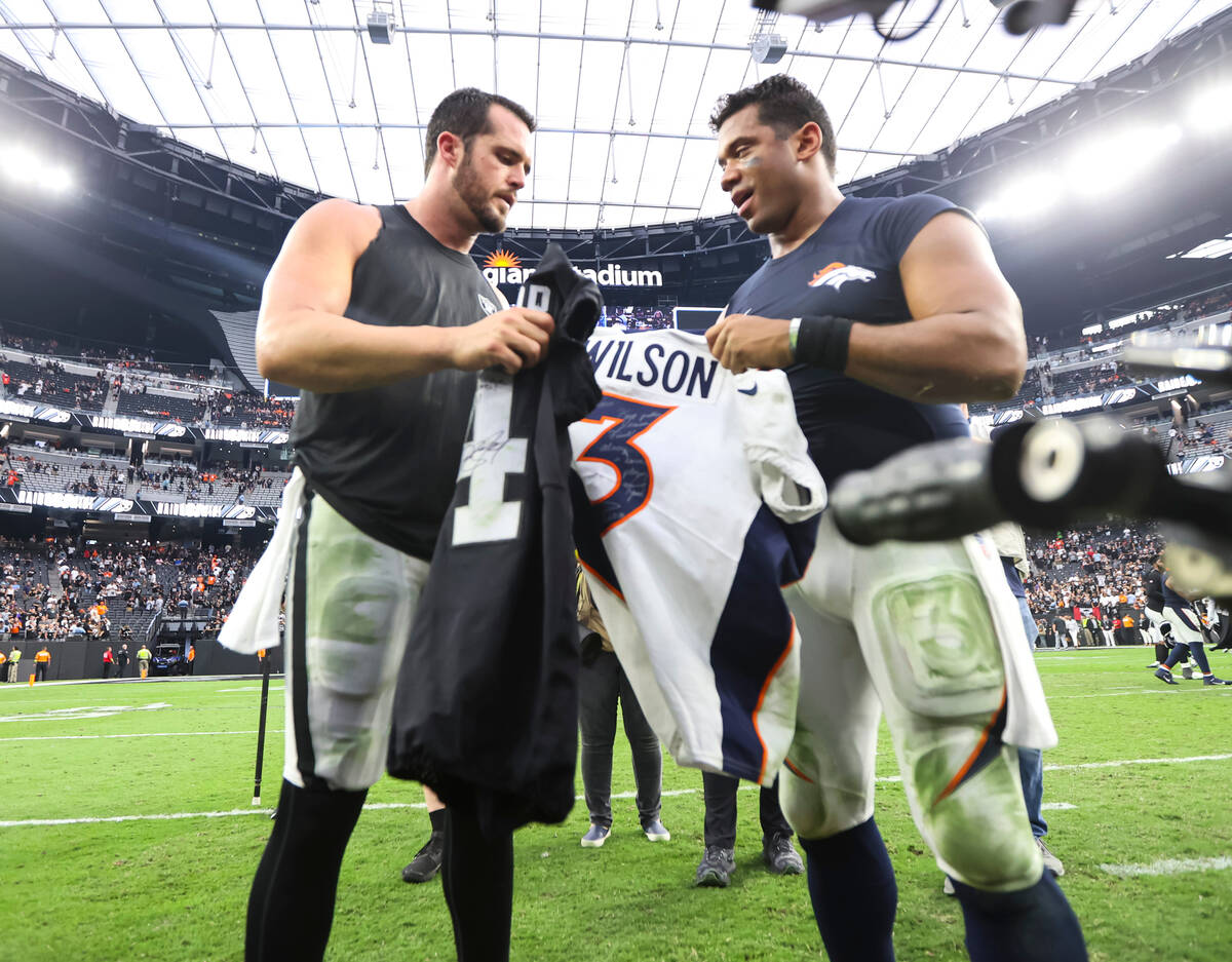Raiders quarterback Derek Carr and Denver Broncos quarterback Russell Wilson trade jerseys afte ...