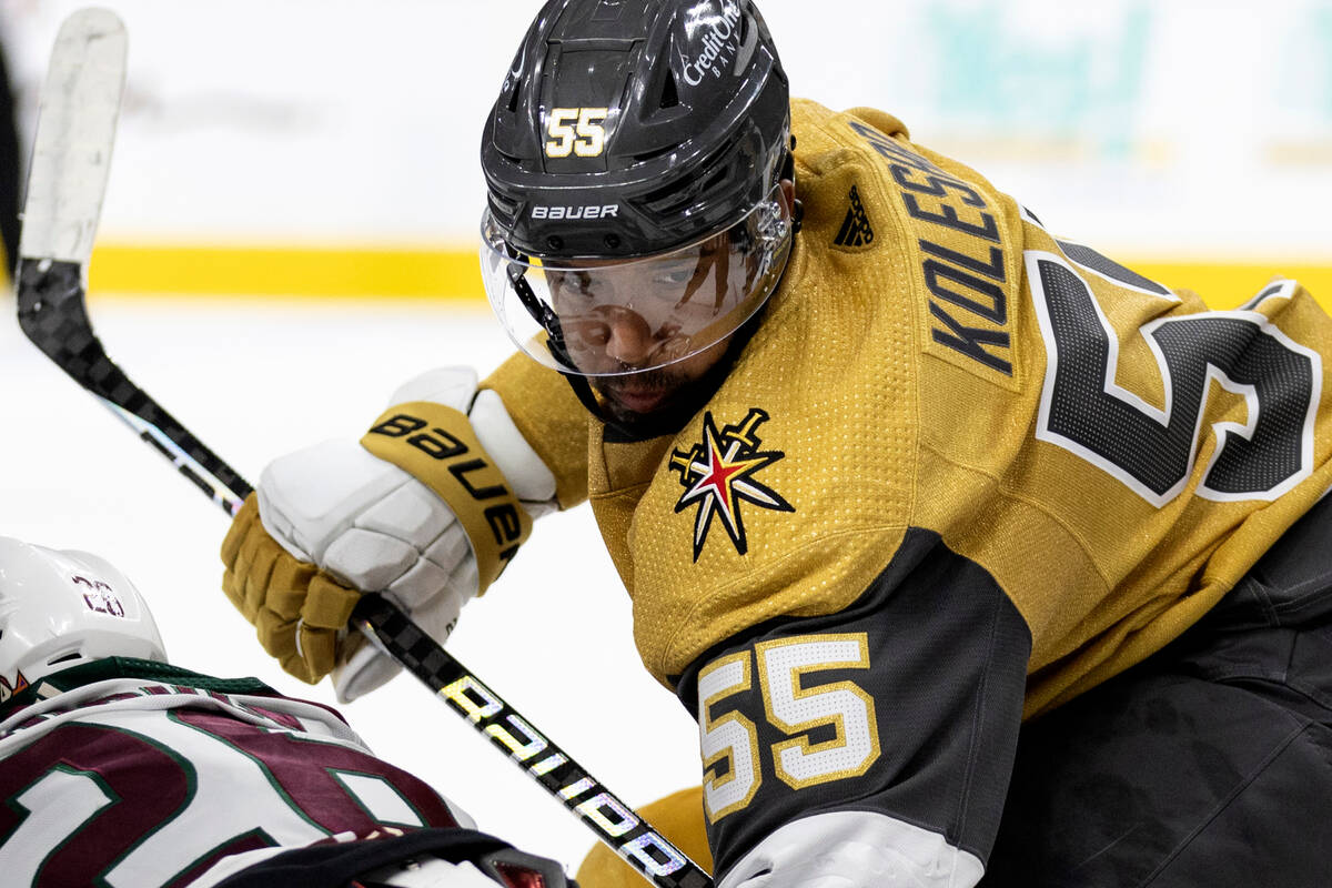 Golden Knights right wing Keegan Kolesar (55) eyes the puck in a face off during the first peri ...