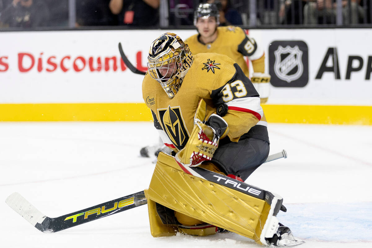 Golden Knights goaltender Adin Hill (33) makes a save during the second period of a preseason N ...