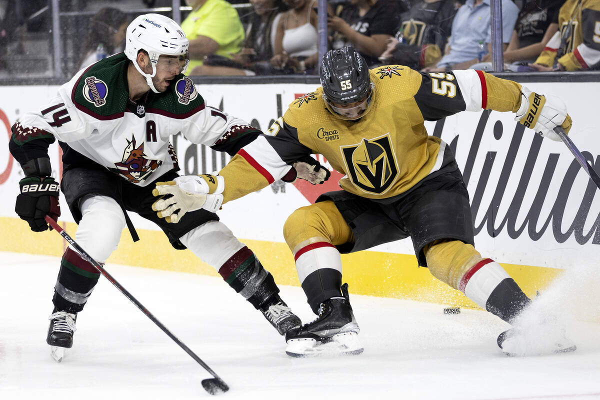 Golden Knights right wing Keegan Kolesar (55) stops as the puck moves behind him while Coyotes ...