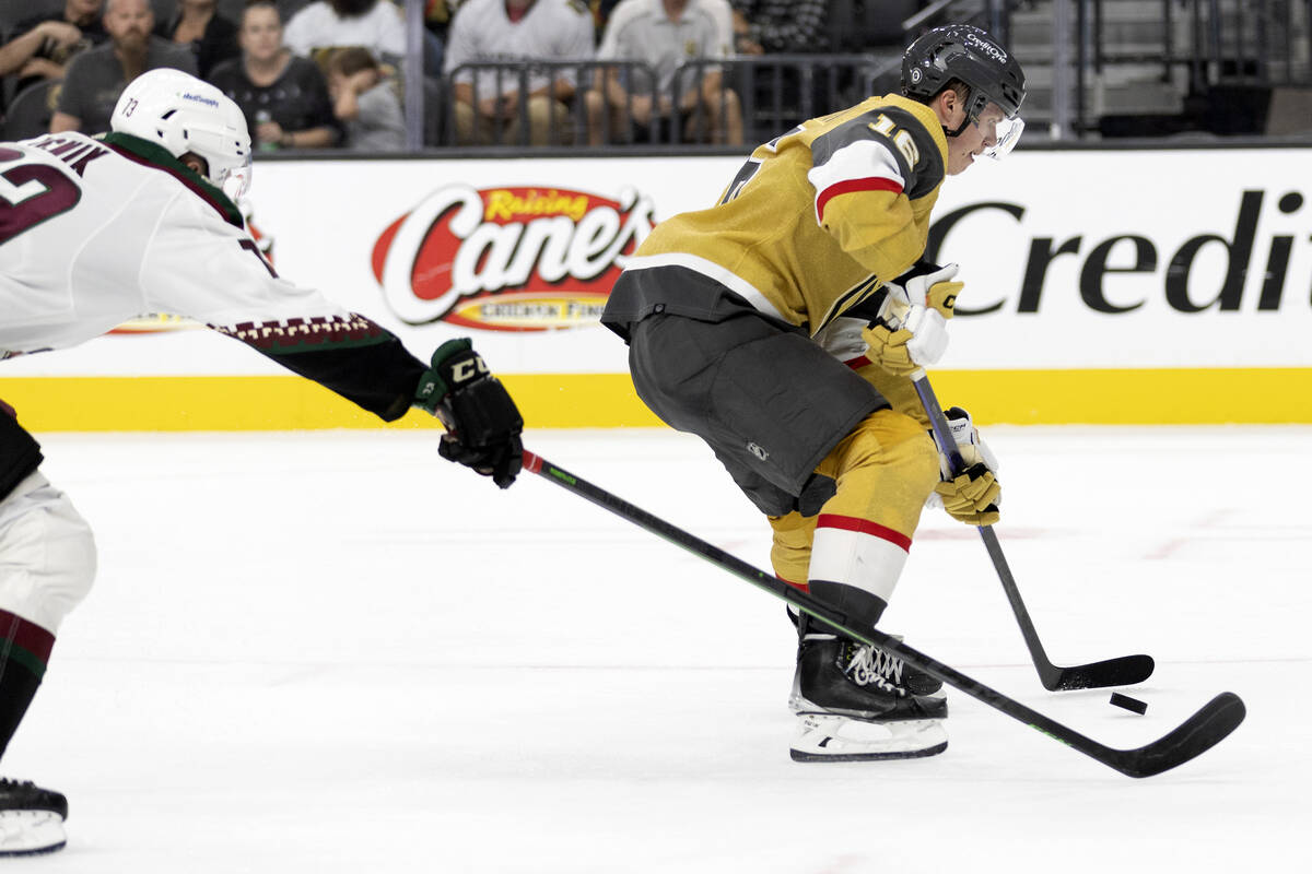 Golden Knights left wing Pavel Dorofeyev (16) is about to score while Coyotes forward Jan Jenik ...