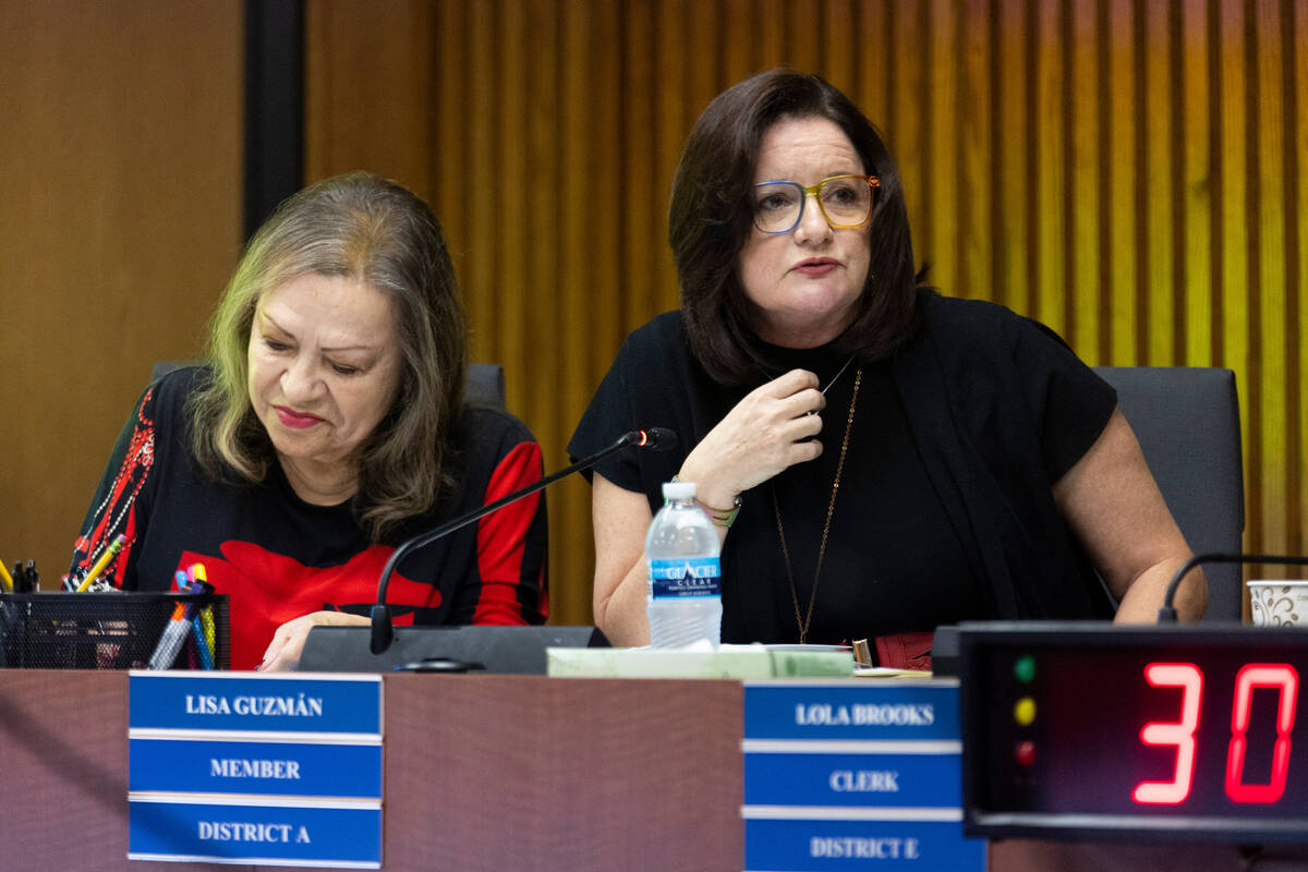 Clark County School Board members Linda Cavazos, left, and Lisa Guzman participate during a boa ...