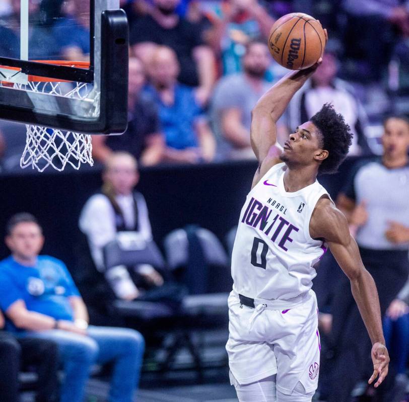 NBA G League Ignite guard Scoot Henderson (0) dunks over the Metropolitans 92 during the first ...