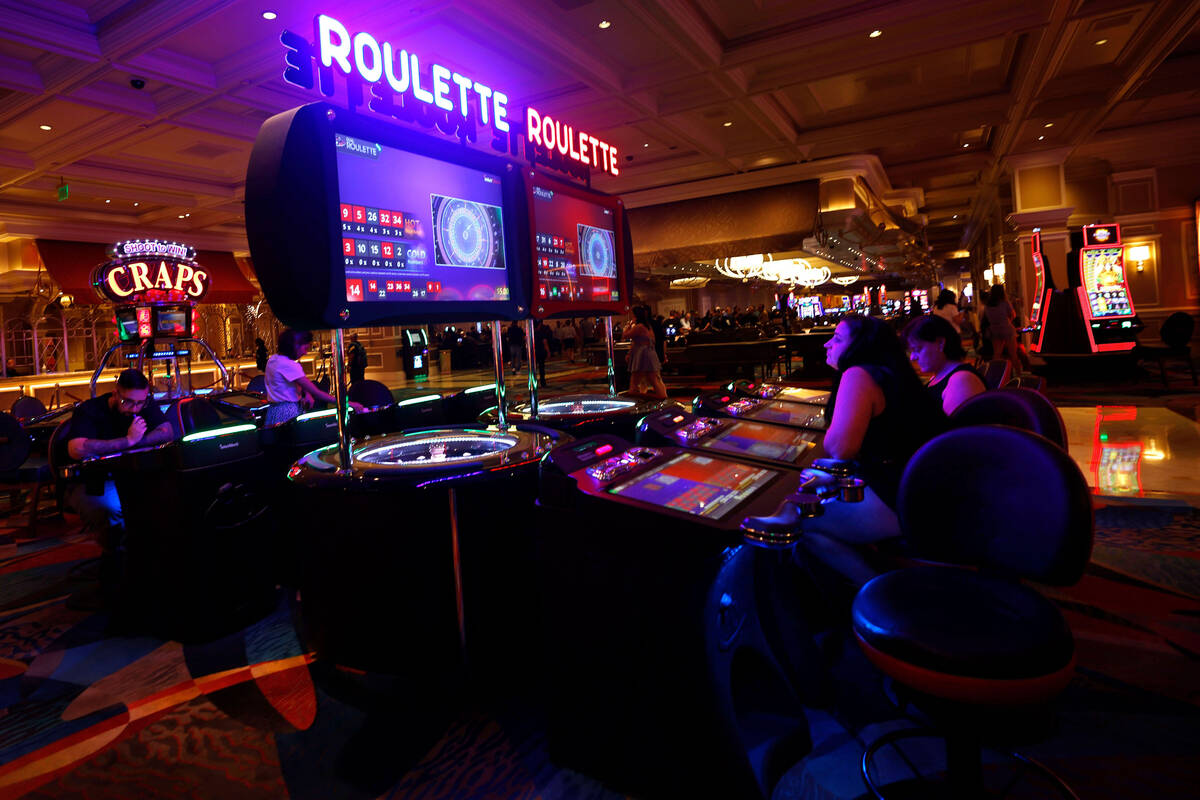 Stacey McLachlan of Vancouver, left, and her mother Sharon play electronic table games at the B ...