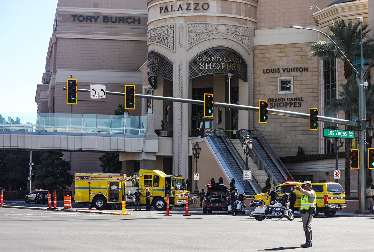 Police at the scene where multiple people were stabbed in front of a Strip casino in Las Vegas, ...