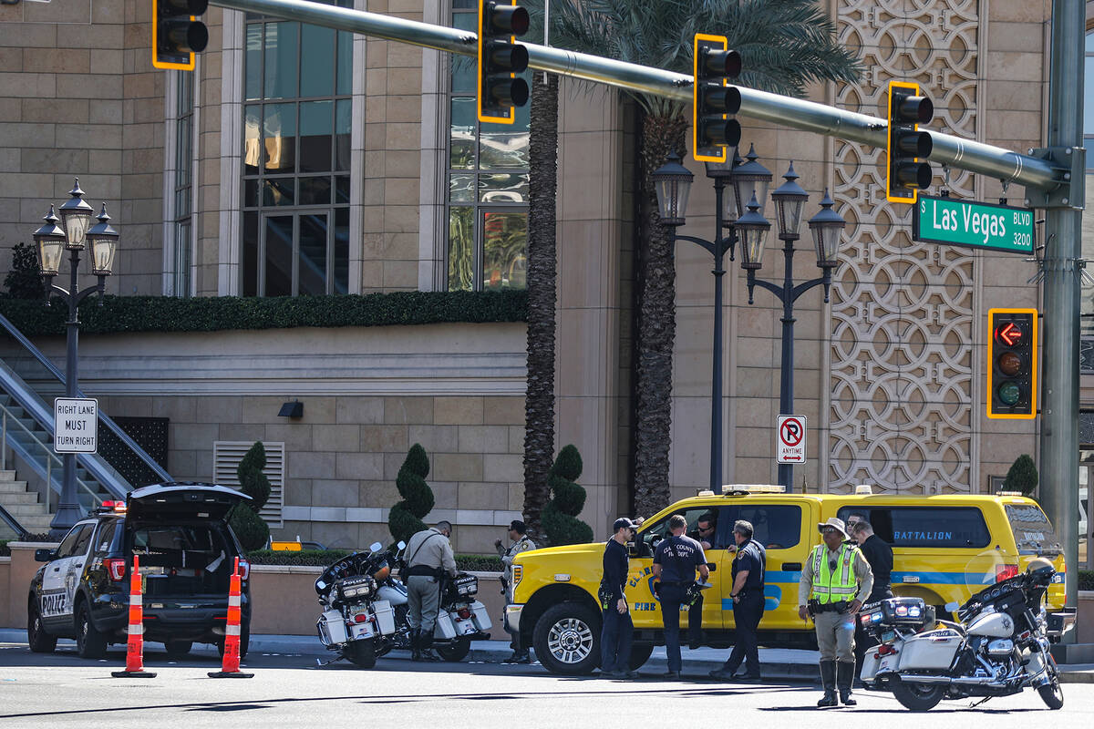 Police at the scene where multiple people were stabbed in front of a Strip casino in Las Vegas, ...