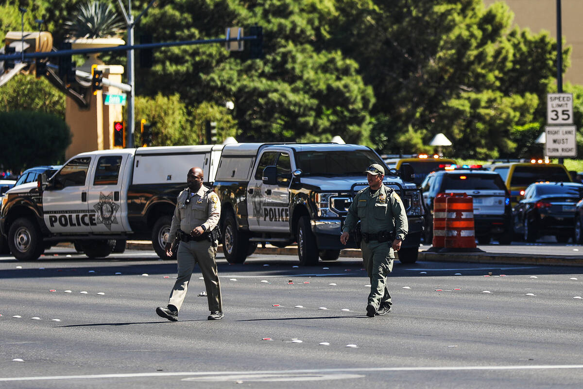 Police at the scene where multiple people were stabbed in front of a Strip casino in Las Vegas, ...