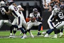 Denver Broncos running back Melvin Gordon III (25) runs the ball against the Las Vegas Raiders ...