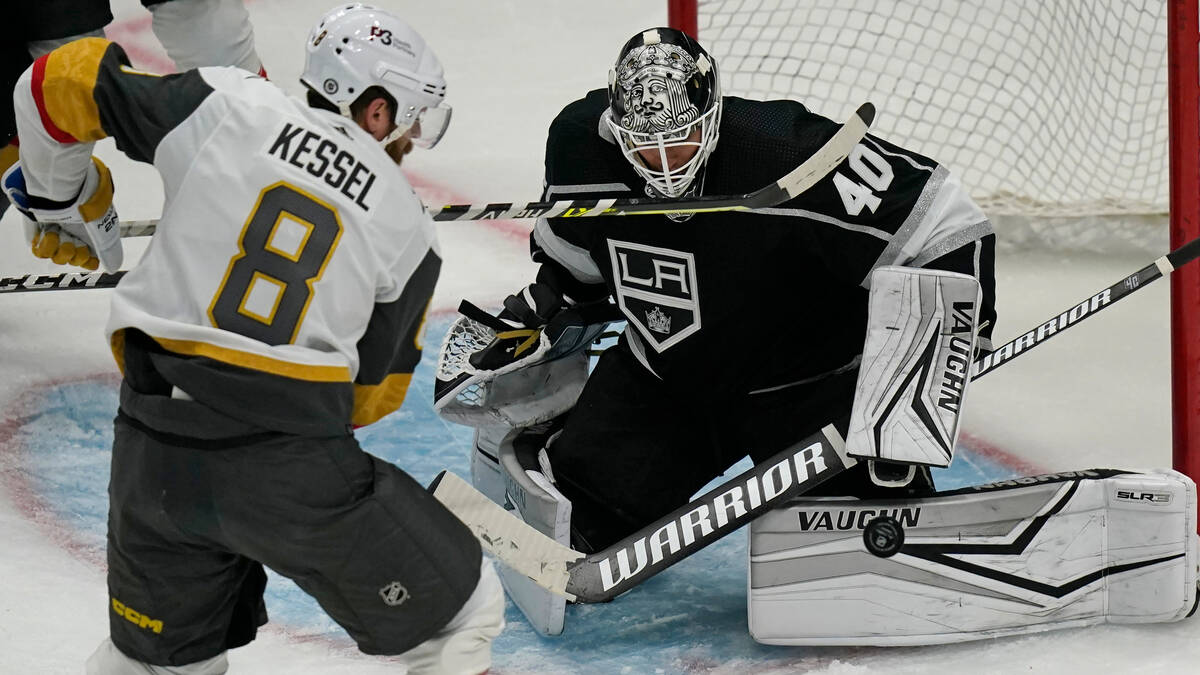 Los Angeles Kings goaltender Cal Petersen (40) makes a save as Vegas Golden Knights center Phil ...