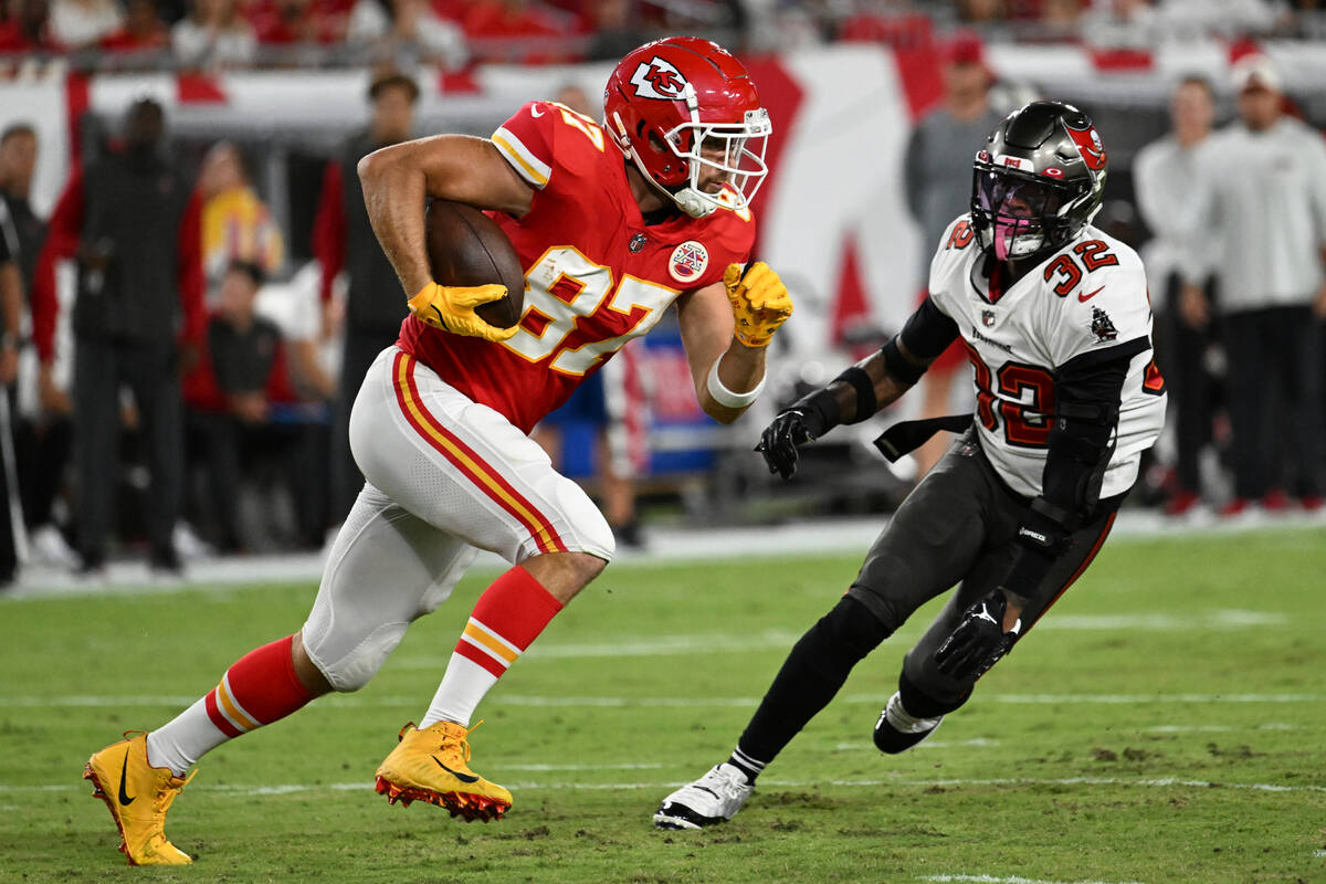 Kansas City Chiefs tight end Travis Kelce (87) is chased by Tampa Bay Buccaneers safety Mike Ed ...