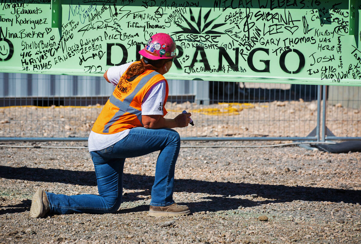 A construction worker signs the celebratory beam at the Durango Casino and Resort on Friday, Oc ...
