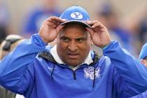BYU coach Kalani Sitake waits for the team's NCAA college football game against Utah State on T ...