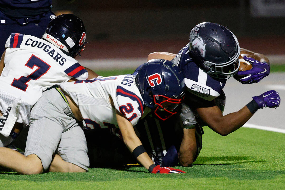 Shadow Ridge’s JaQuieze Holland is tackled by Coronado’s Roderick  Edwa ...