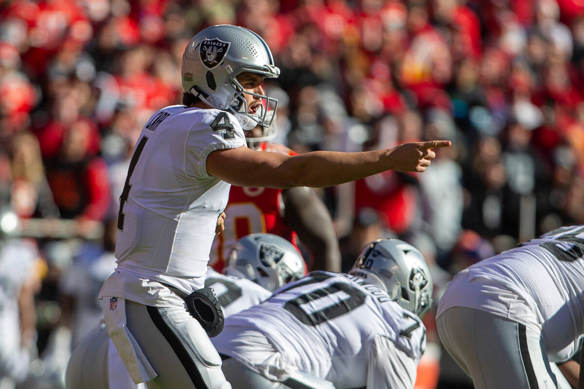 Raiders quarterback Derek Carr (4) calls a play at the line of scrimmage during the first quart ...