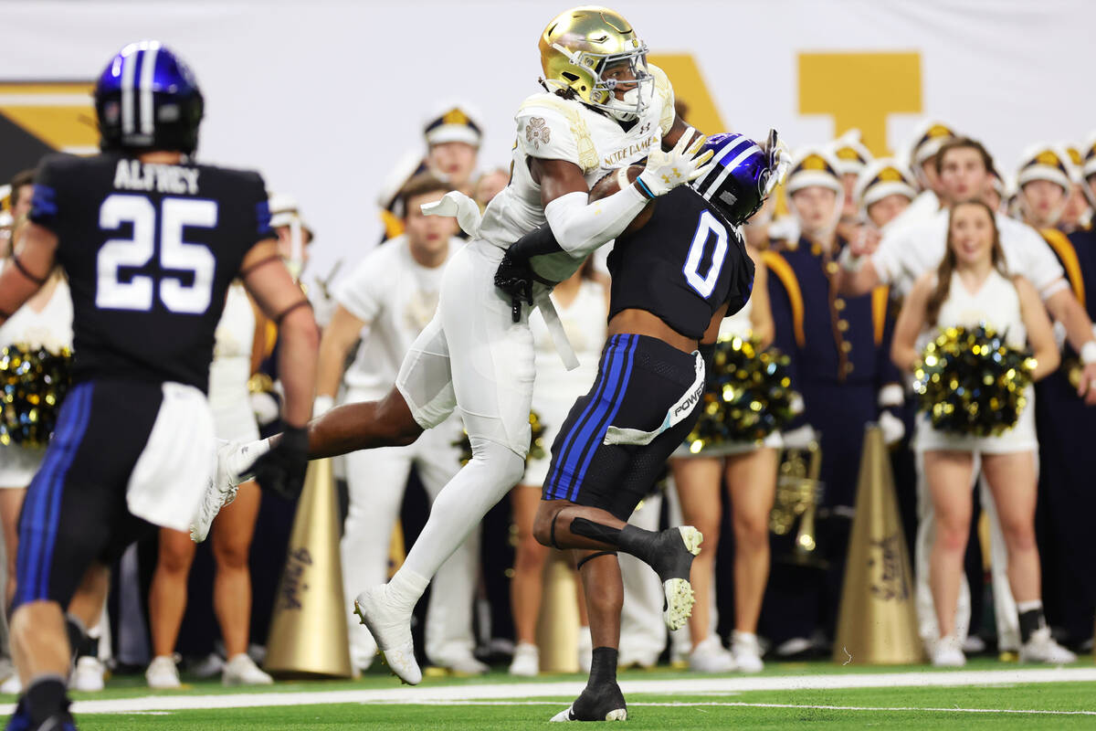 Notre Dame Fighting Irish wide receiver Jayden Thomas (83) makes a touchdown catch under pressu ...