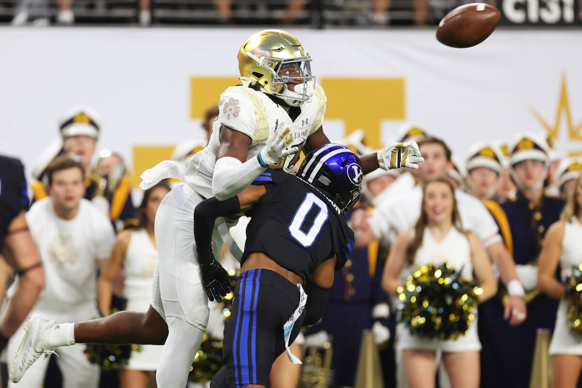 Notre Dame Fighting Irish wide receiver Jayden Thomas (83) makes a touchdown catch under pressu ...