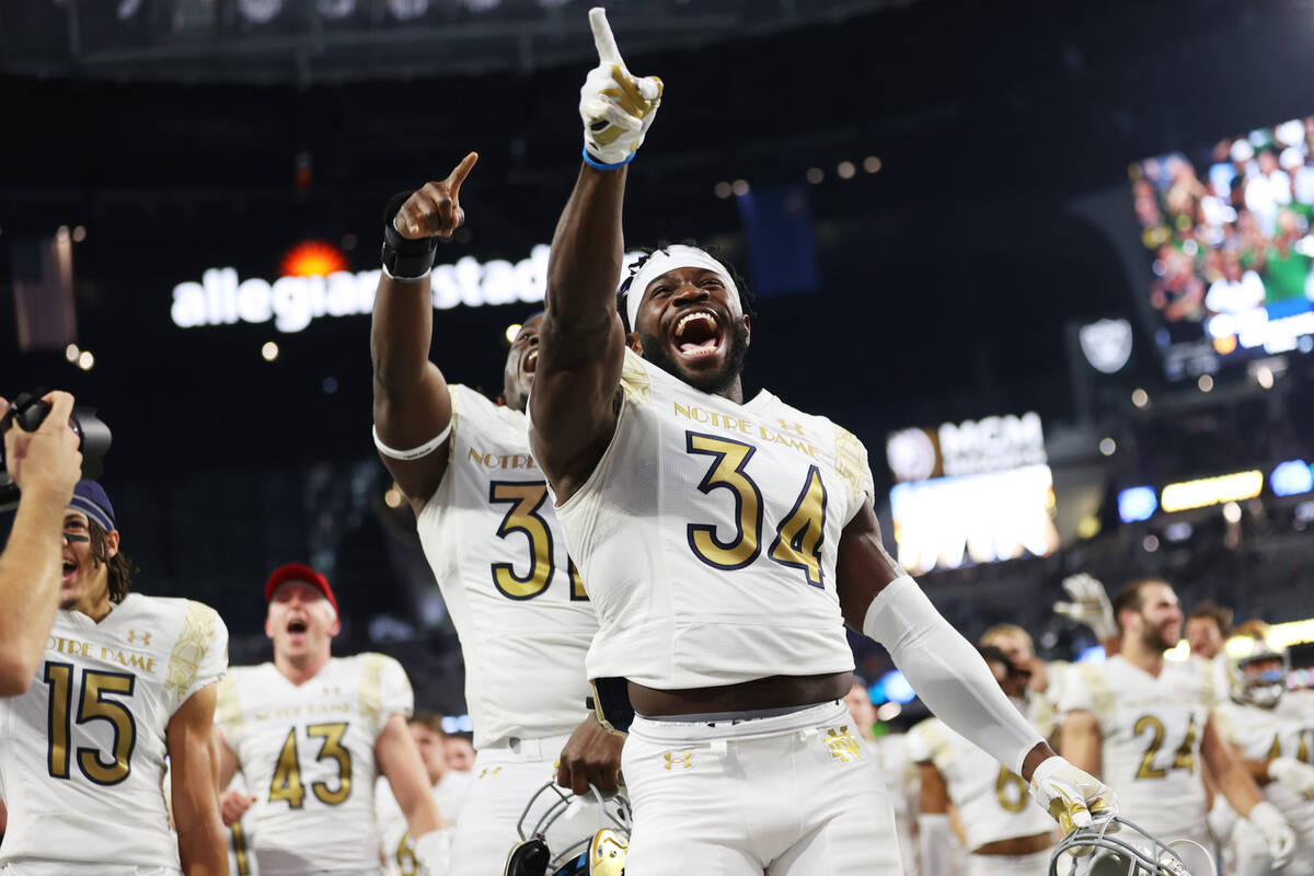 Notre Dame Fighting Irish defensive lineman Osita Ekwonu (34) celebrates his team's win against ...