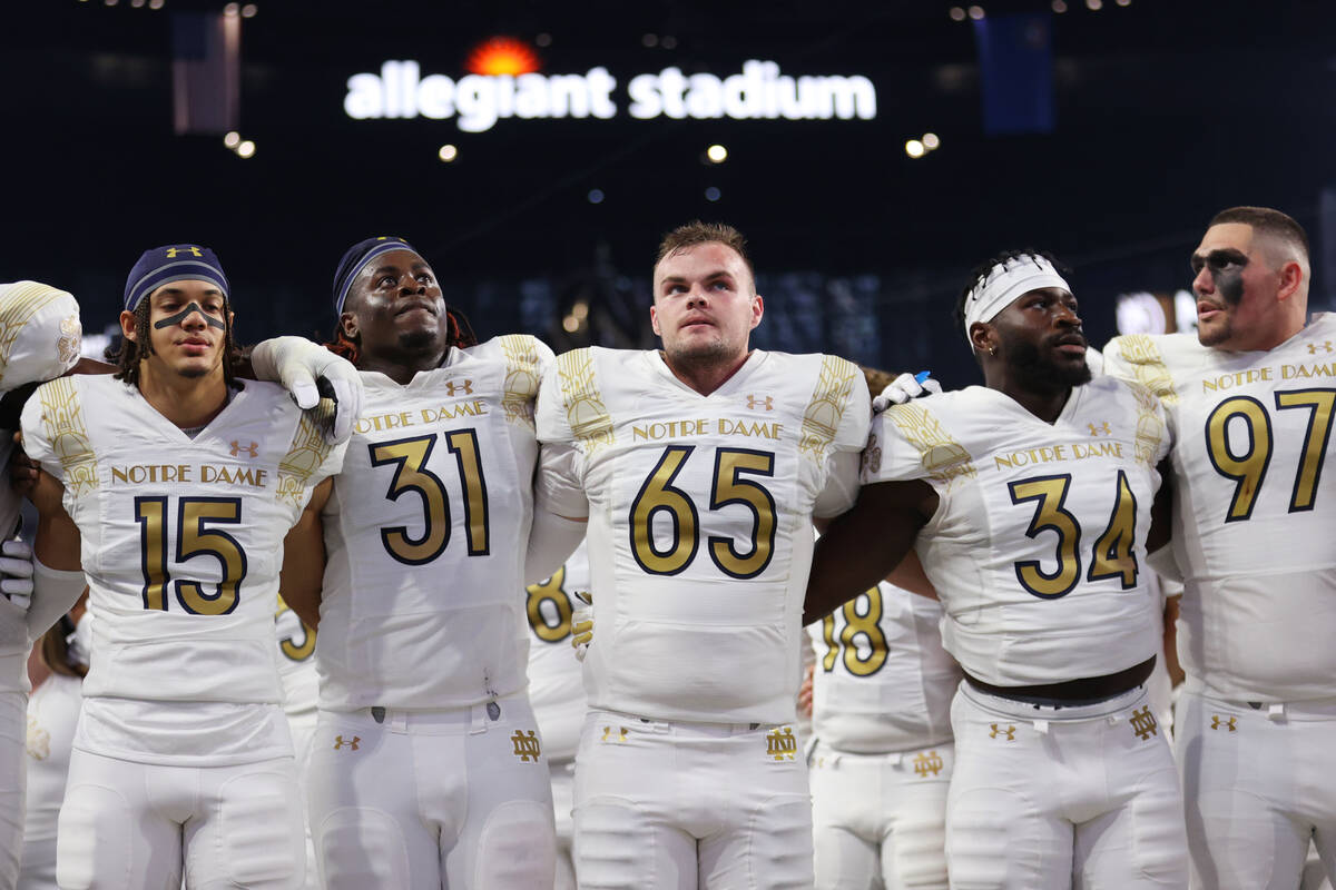 The Notre Dame Fighting Irish celebrate their win against the Brigham Young Cougars during a NC ...