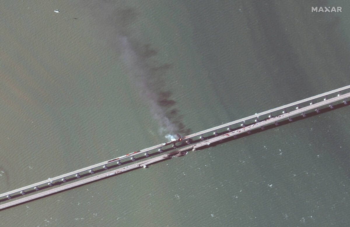 This satellite image provided by Maxar Technologies shows damage to the Kerch Bridge, which con ...