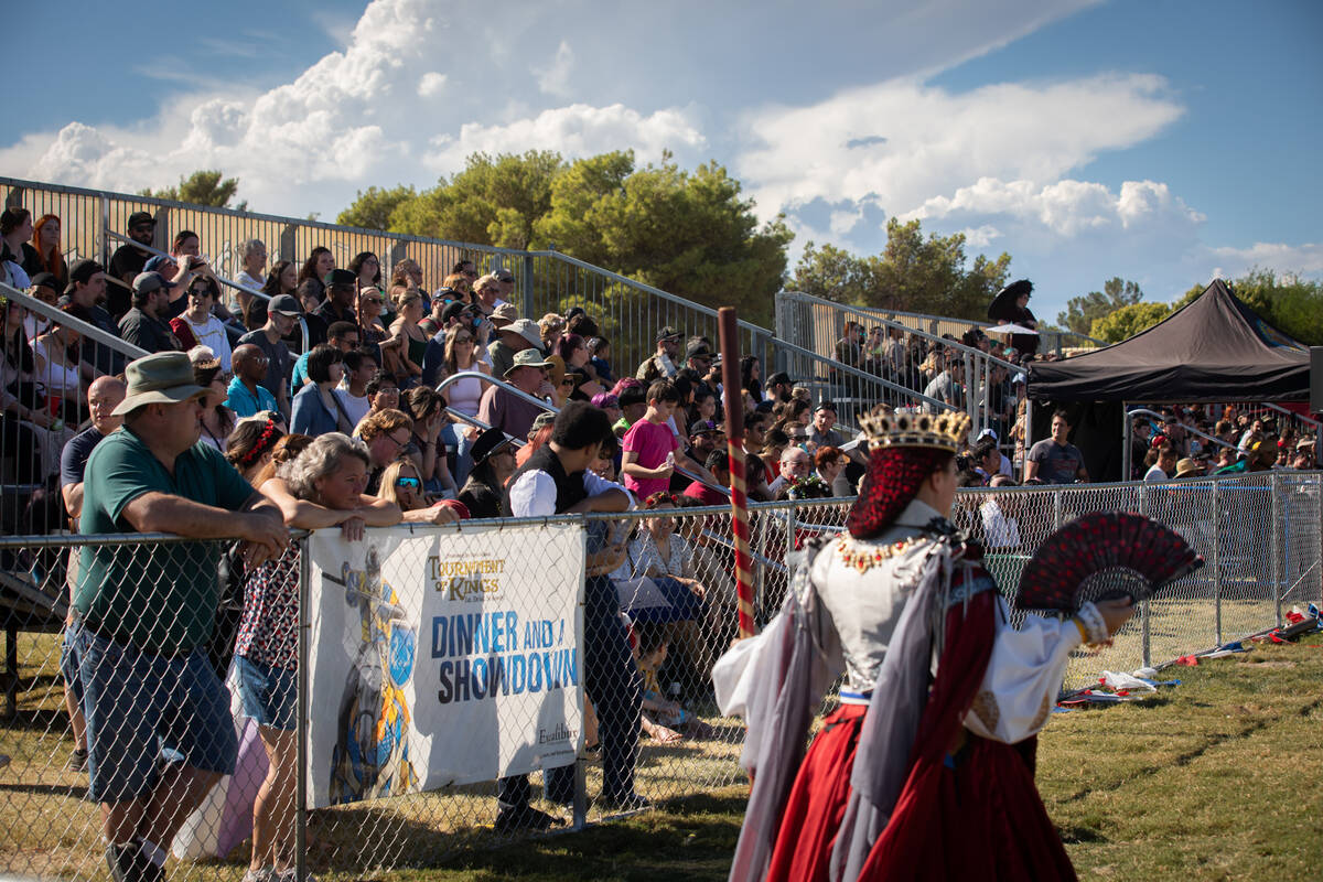 Attendees watch a tourney at the Age of Chivalry Renaissance Festival on Sunday, Oct. 9, 2022, ...